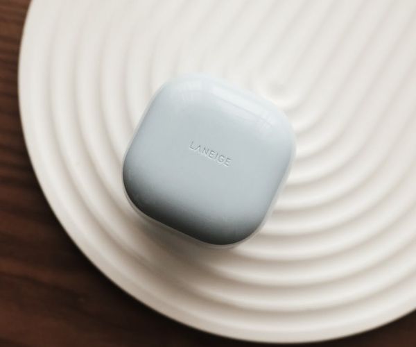 A calm and spacious studio with minimalist design and soft lighting.